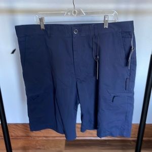 Greg Norman golf shorts, navy size 38